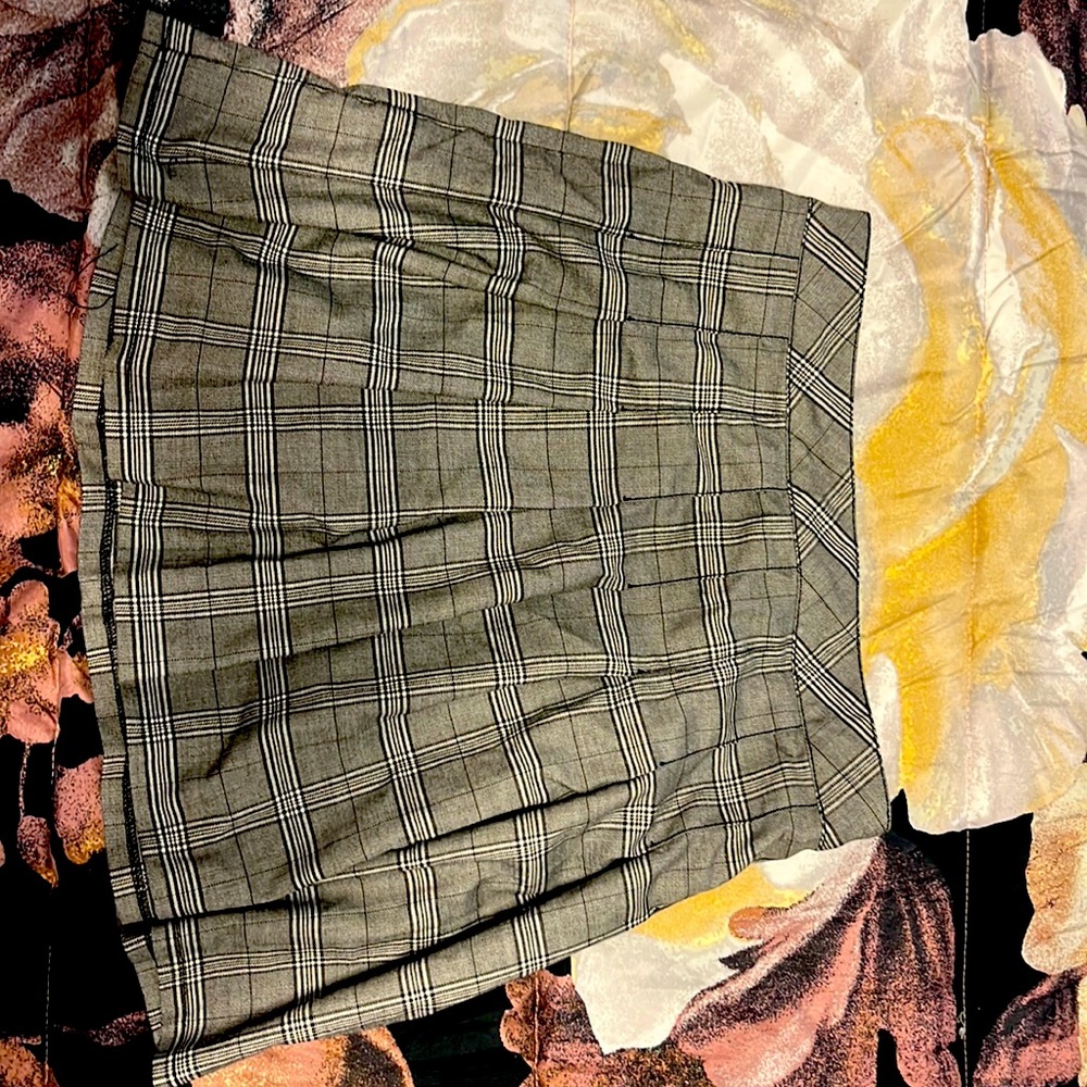 I am selling a large plaid black, grey and white skirt